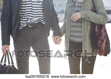 Stock Photograph - Couple holding hands. Fotosearch