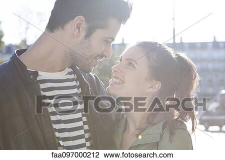 Couple looking at each other lovingly View Large Photo Image Stock Image - Couple looking at each other lovingly. Fotosearch