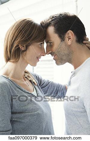 Couple touching noses View Large Photo Image Stock Photo - Couple touching noses. Fotosearch