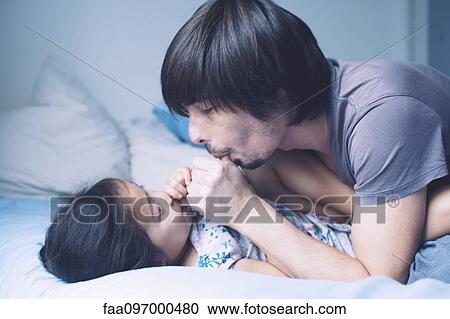 Stock Image - Father spending quality time with young daughter. Fotosearch