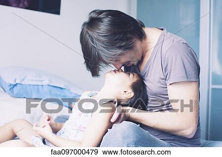Father spending quality time with young daughter View Large Photo Image Stock Photo - Father spending quality time with young daughter. Fotosearch