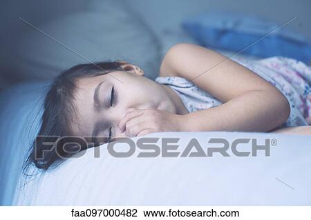 Little girl asleep, portrait View Large Photo Image Stock Image - Little girl asleep, portrait. Fotosearch