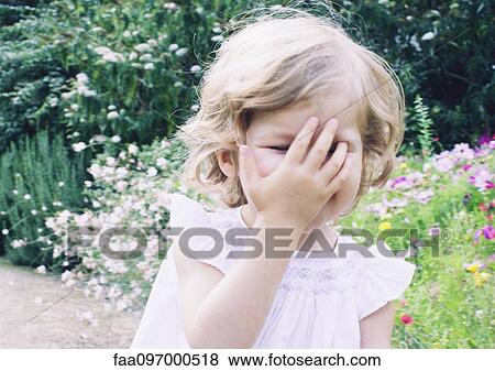 Stock Photo - Little girl on nature path, portrait. Fotosearch