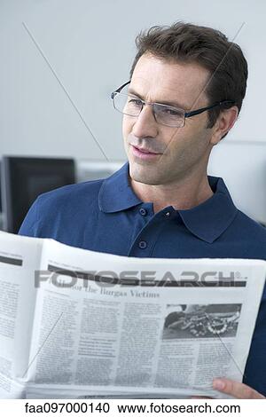 Man reading newspaper View Large Photo Image Stock Image - Man reading newspaper. Fotosearch