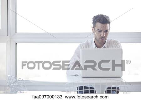 Man using laptop computer View Large Photo Image Stock Image - Man using laptop computer. Fotosearch