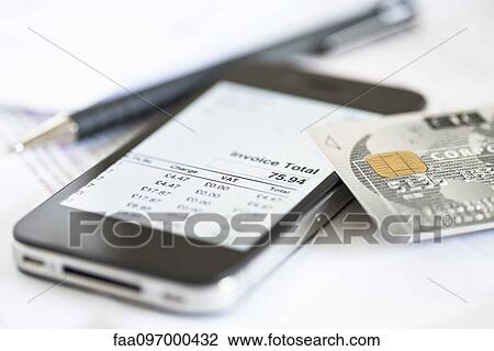 Stock Image - Smartphone being used for online banking. Fotosearch