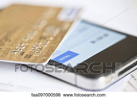 Stock Photo - Smartphone being used for online banking. Fotosearch