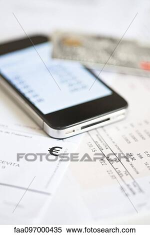 Stock Photography - Smartphone being used for online banking. Fotosearch