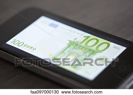 Smartphone displaying image of one-hundred euro banknote View Large Photo Image Stock Image - Smartphone displaying image of one-hundred euro banknote. Fotosearch