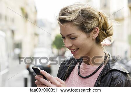 Smartphones allow us to connect and communicate with others with ease View Large Photo Image Stock Image - Smartphones allow us to connect and communicate with others with ease. Fotosearch