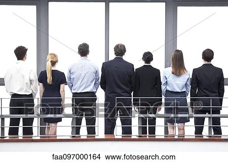 Picture - Team of business professionals, rear view. Fotosearch