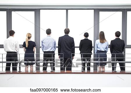 Team of business professionals, rear view View Large Photo Image Stock Photography - Team of business professionals, rear view. Fotosearch