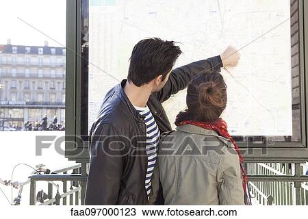 Tourists looking at map View Large Photo Image Stock Image - Tourists looking at map. Fotosearch