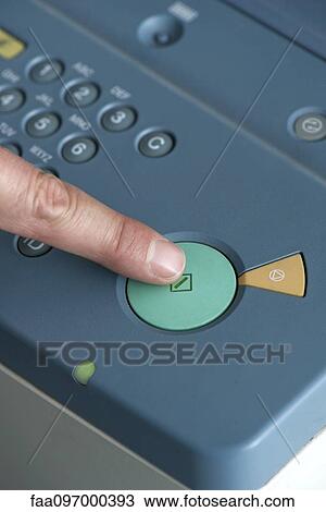 Stock Image - Using photocopier, close-up. Fotosearch