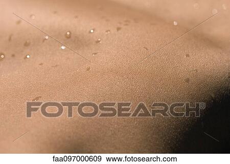 Stock Photo - Water droplets on skin. Fotosearch