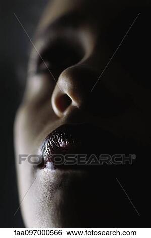 Stock Photograph - Woman looking up, extreme close-up. Fotosearch