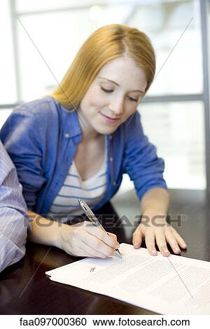 Woman signing contract View Large Photo Image Stock Image - Woman signing contract. Fotosearch
