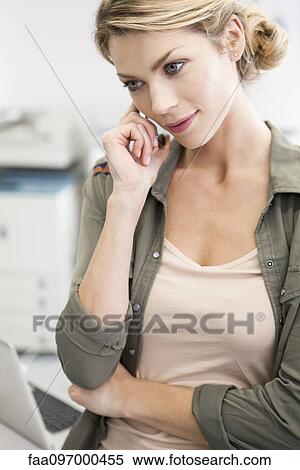 Stock Photography - Woman talking on cell phone. Fotosearch
