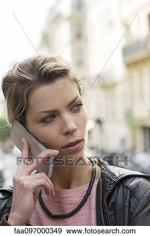 Stock Photo - Woman using cell phone. Fotosearch