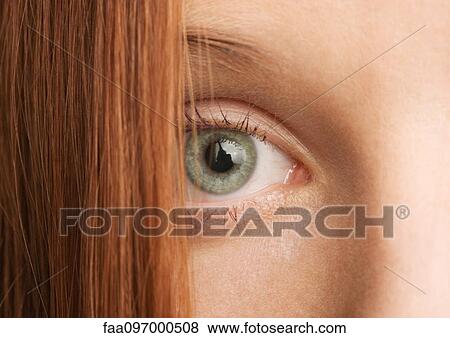 Woman's eye and red hair, close-up View Large Photo Image Stock Photo - Woman's eye and red hair, close-up. Fotosearch