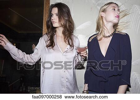 Stock Photo - Women with cocktails at party. Fotosearch