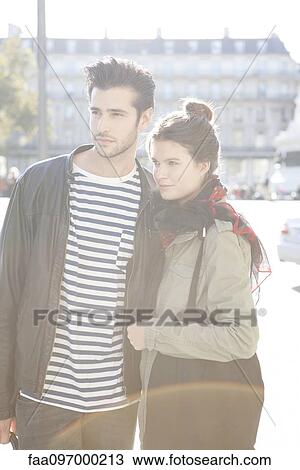 Stock Image - Young couple together for city outing. Fotosearch