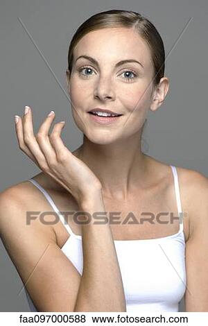 Young woman looking questioningly at camera View Large Photo Image Stock Photo - Young woman looking questioningly at camera. Fotosearch