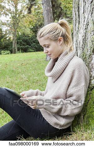 Stock Photo - Bloggers enjoy the freedom of creating and uploading posts from wherever they may be. Fotosearch