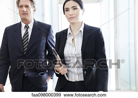 Business executives on the move together View Large Photo Image Stock Photo - Business executives on the move together. Fotosearch