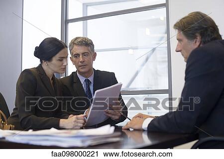 Business meeting, business associates reviewing contract View Large Photo Image Stock Image - Business meeting, business associates reviewing contract. Fotosearch
