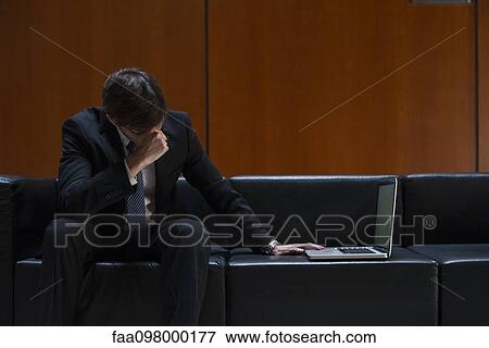 Businessman covering eyes with hand in disbelief View Large Photo Image Stock Photo - Businessman covering eyes with hand in disbelief. Fotosearch
