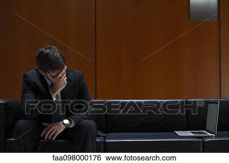 Businessman covering eyes with hand in disbelief View Large Photo Image Stock Photograph - Businessman covering eyes with hand in disbelief. Fotosearch