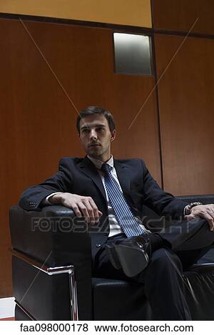 Stock Photo - Businessman in waiting room. Fotosearch