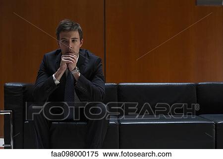 Businessman waiting anxiously for appointment View Large Photo Image Stock Photography - Businessman waiting anxiously for appointment. Fotosearch