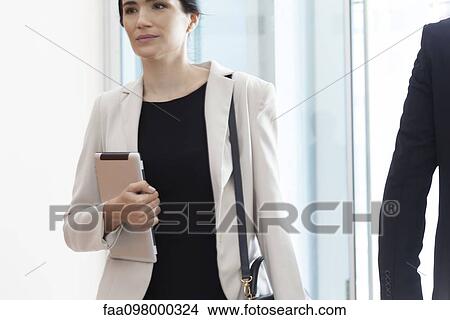 Picture - Businesswoman on the move. Fotosearch