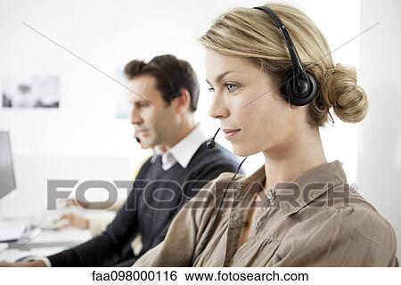 Stock Photograph - Call center saleswoman on phone call. Fotosearch