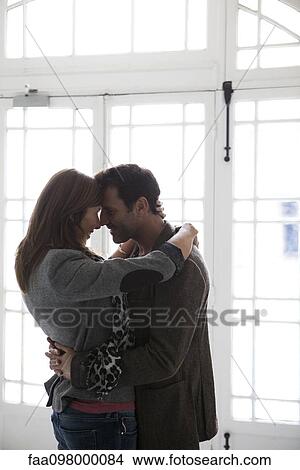 Picture - Couple embracing, silhouette. Fotosearch