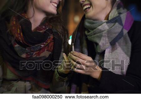 Friends bonding over cigarette View Large Photo Image Stock Image - Friends bonding over cigarette. Fotosearch