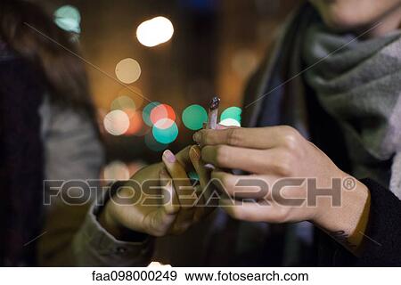 Friends passing joint View Large Photo Image Stock Photo - Friends passing joint. Fotosearch