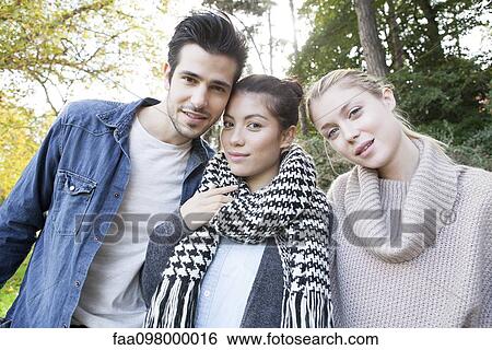 Stock Photograph - Friends spending time together, portrait. Fotosearch
