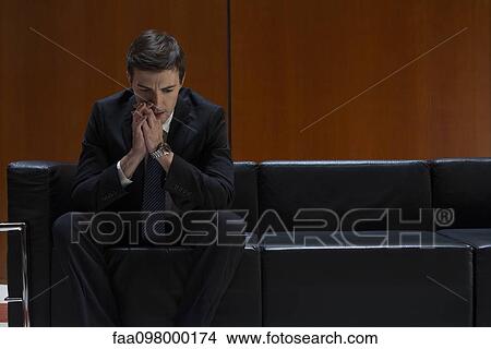 Job applicant nervously waiting for interview to begin View Large Photo Image Picture - Job applicant nervously waiting for interview to begin. Fotosearch