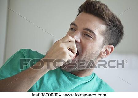 Picture - Man eating apple. Fotosearch