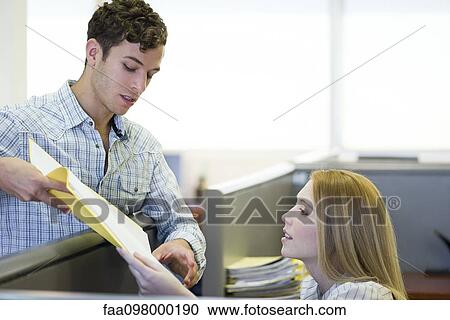 Manager explaining assignment to office worker View Large Photo Image Stock Image - Manager explaining assignment to office worker. Fotosearch