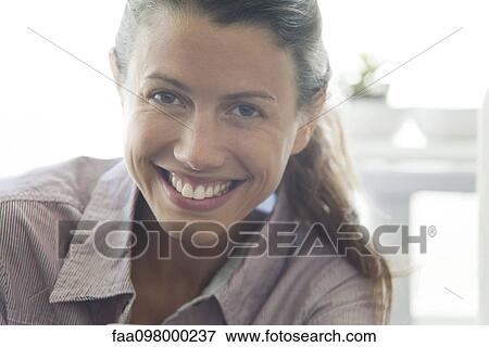 Stock Photo - Mid-adult woman, portrait. Fotosearch