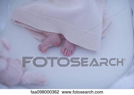 New born baby's feet under blanket View Large Photo Image Stock Image - New born baby's feet under blanket. Fotosearch