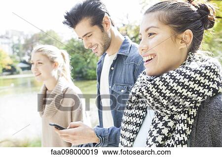 Tourists using mobile app for directions View Large Photo Image Stock Photo - Tourists using mobile app for directions. Fotosearch