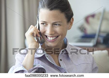 Woman enjoying cell phone conversation View Large Photo Image Stock Image - Woman enjoying cell phone conversation. Fotosearch