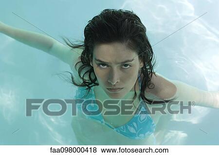 Stock Photo - Woman in pool, portrait. Fotosearch