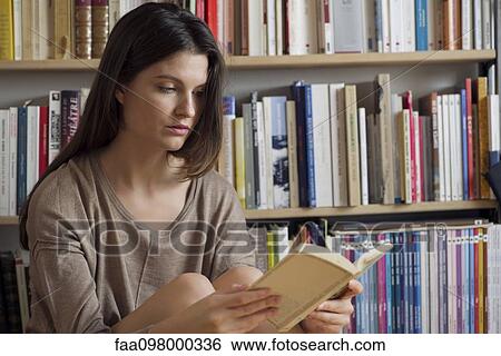 Woman reading book View Large Photo Image Stock Photograph - Woman reading book. Fotosearch