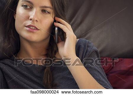 Picture - Woman talking on cell phone. Fotosearch